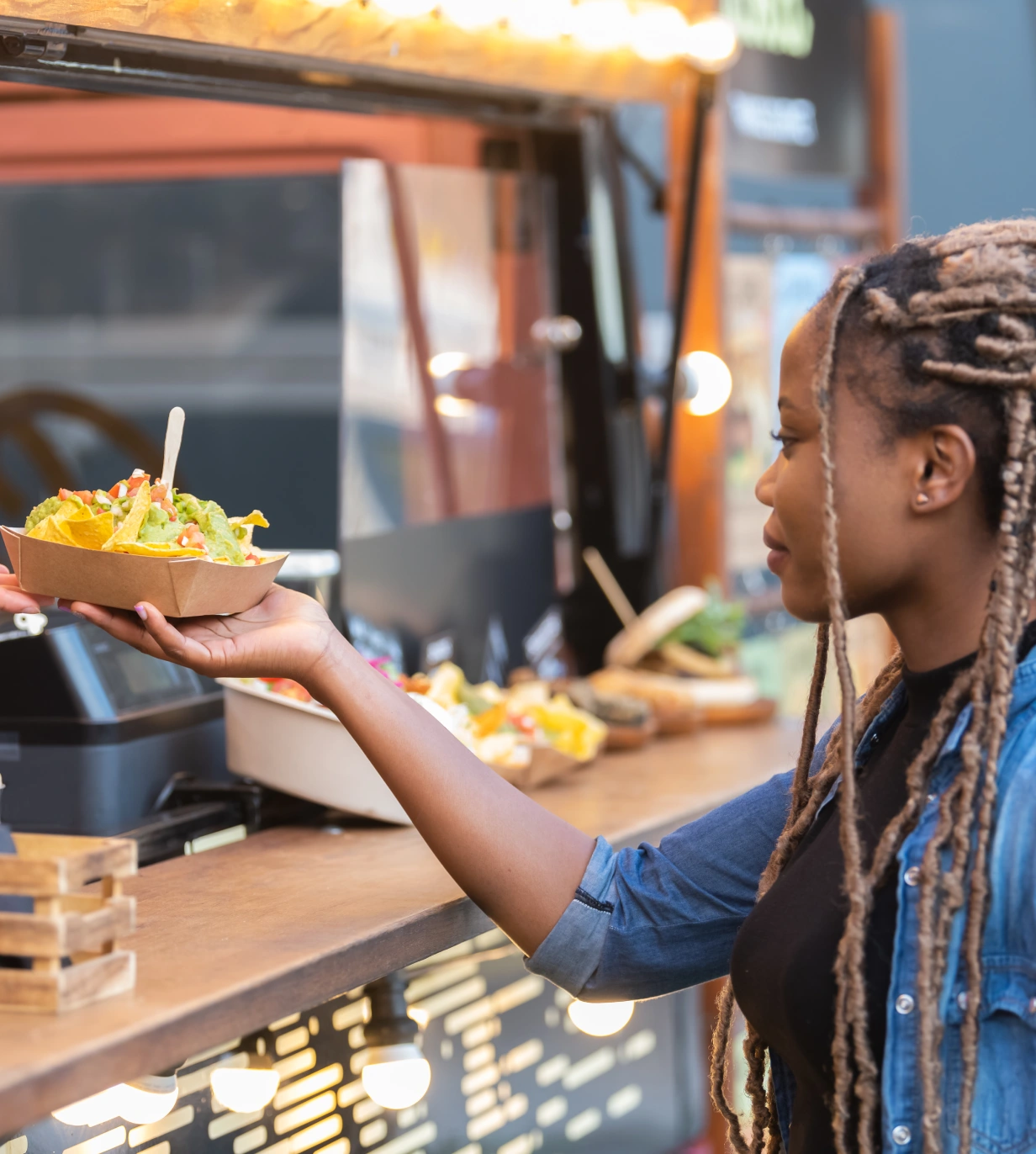 A woman is holding onto a bowl of food